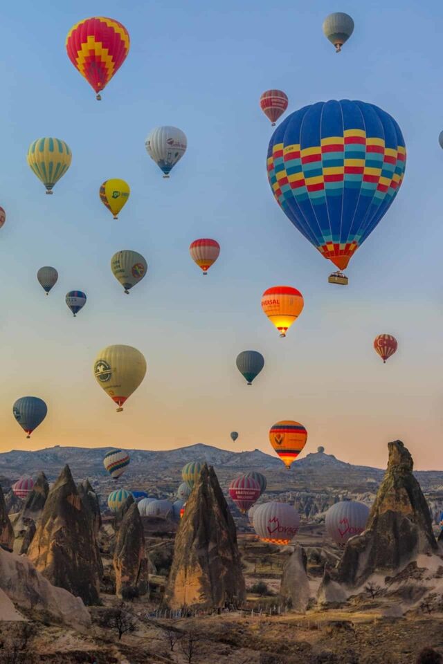 cappadocia turkey hot air baloons over fairy chimneys