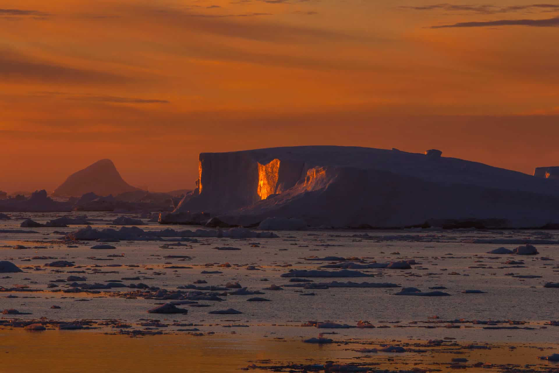 Greenland iceberg at sunset